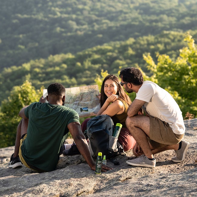 people hiking with repellant